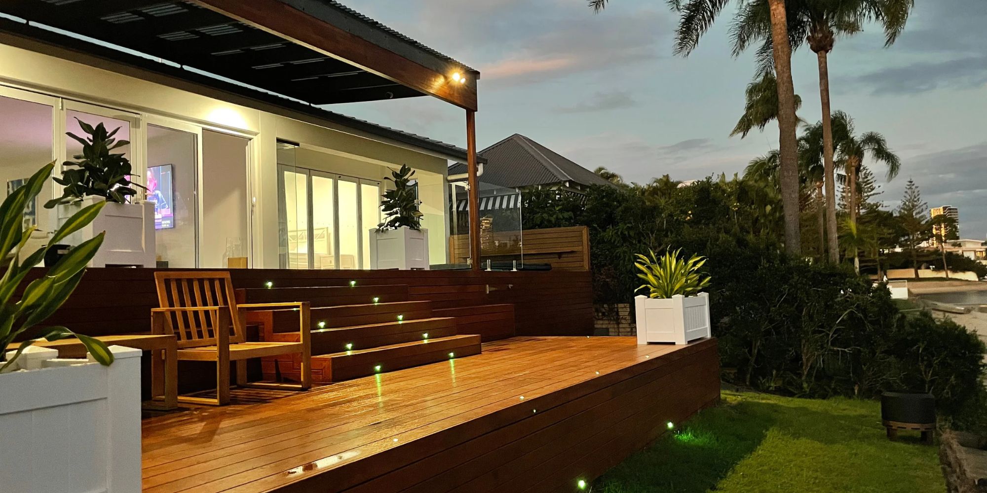 Multi-level wood deck with evening lighting