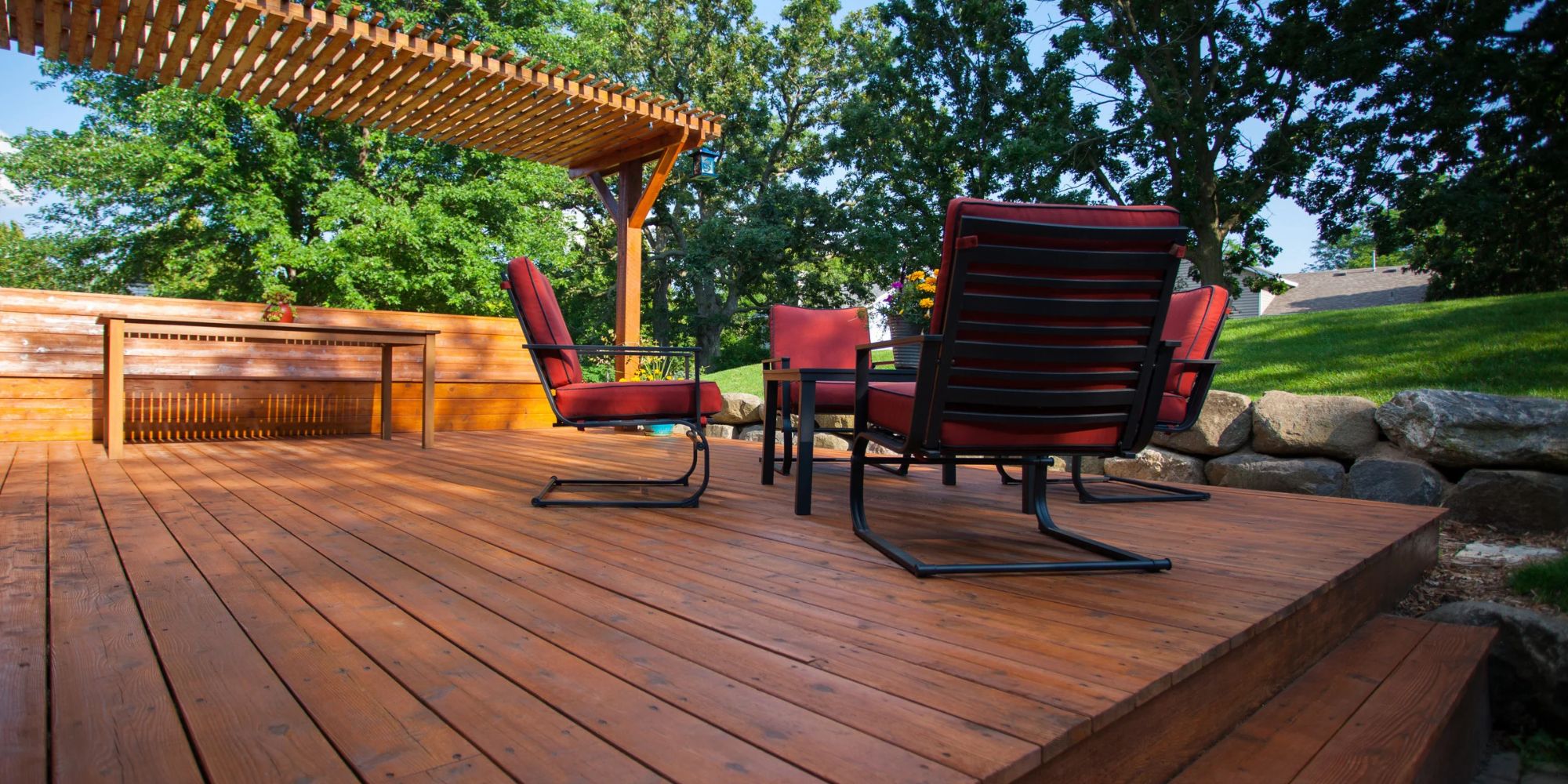 Wood deck with pergola and lounge seating